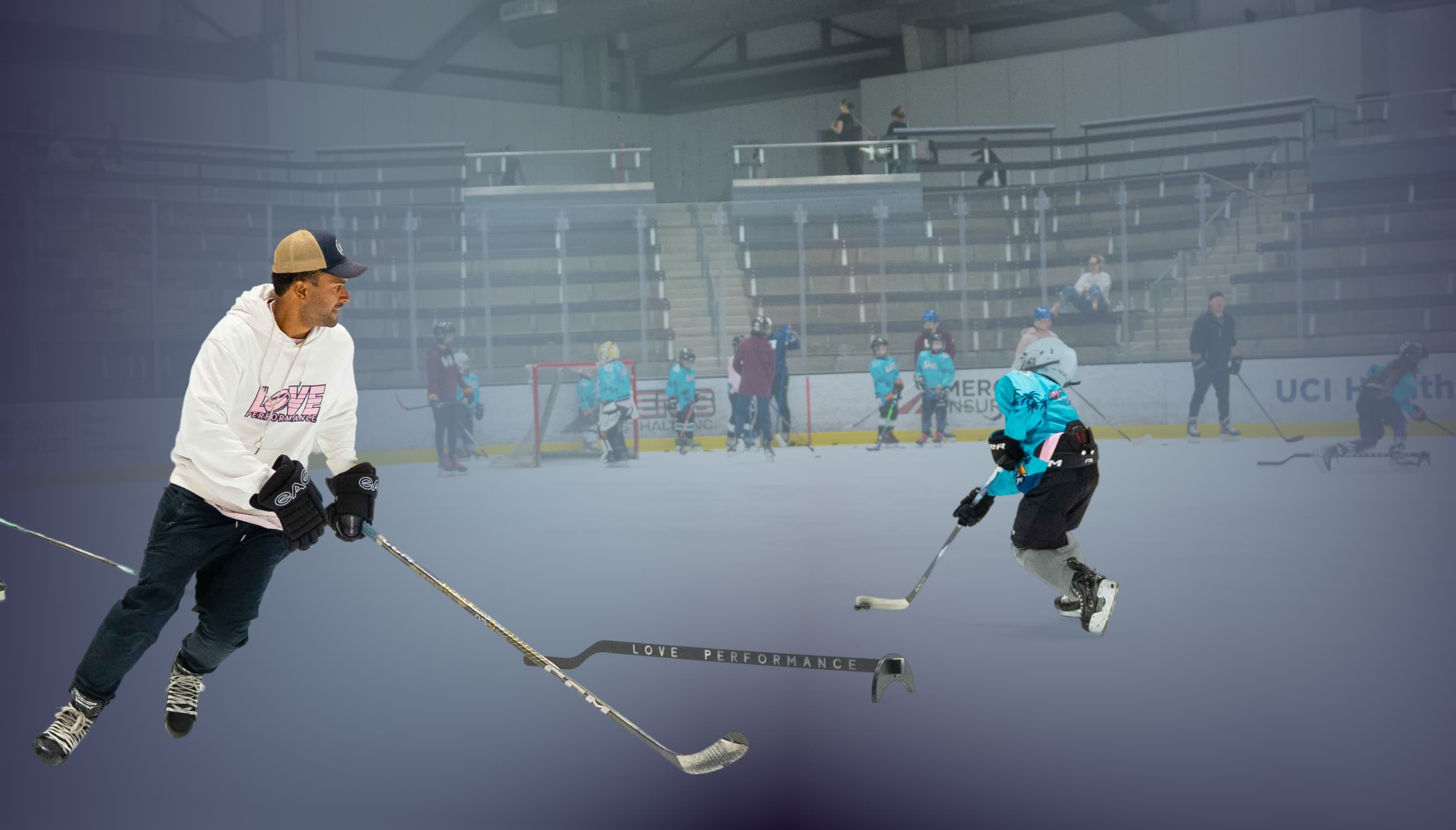 Group of young hockey players running a skills clinic